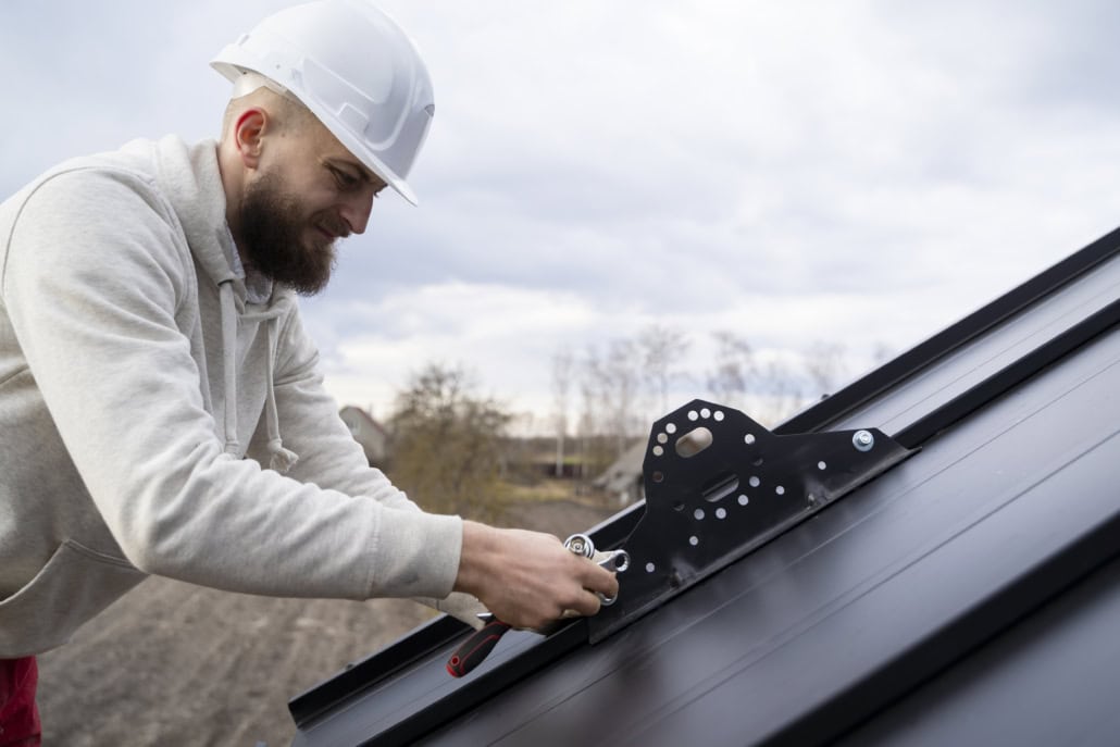 A licensed roofer working on the construction of a residential roof. To get your free estimate, reach out to us today.