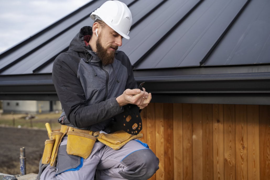 A certified roofing expert repairing a commercial roof. Reach out to us today for a free estimate.
