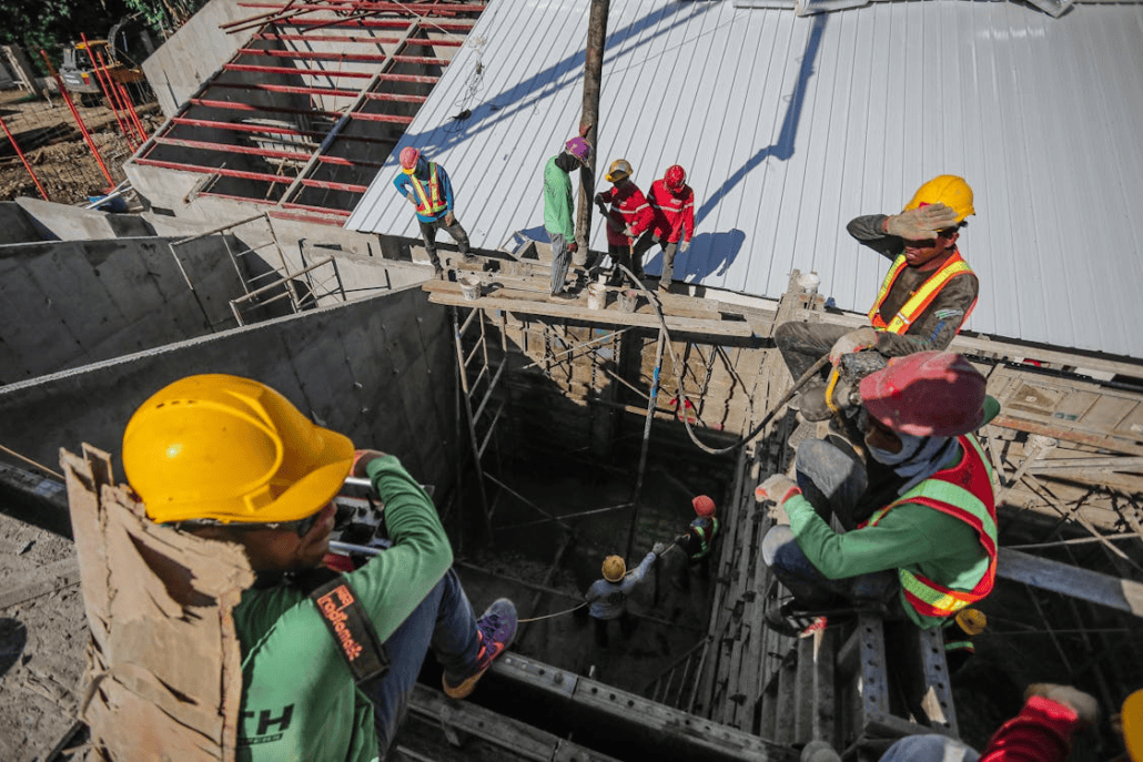 Licensed roofing contractors working on the construction of a roof. Reach out to us today to get your free estimate.