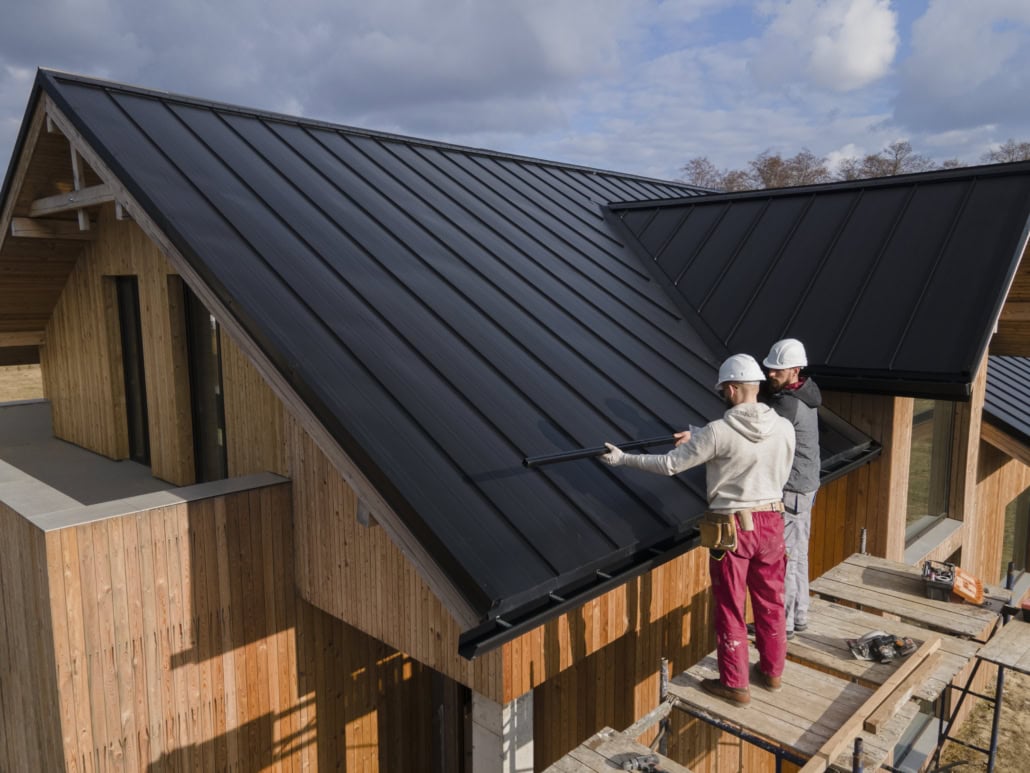 A licensed roofer repairing a rooftop with focus and precision. Get your free estimate today.