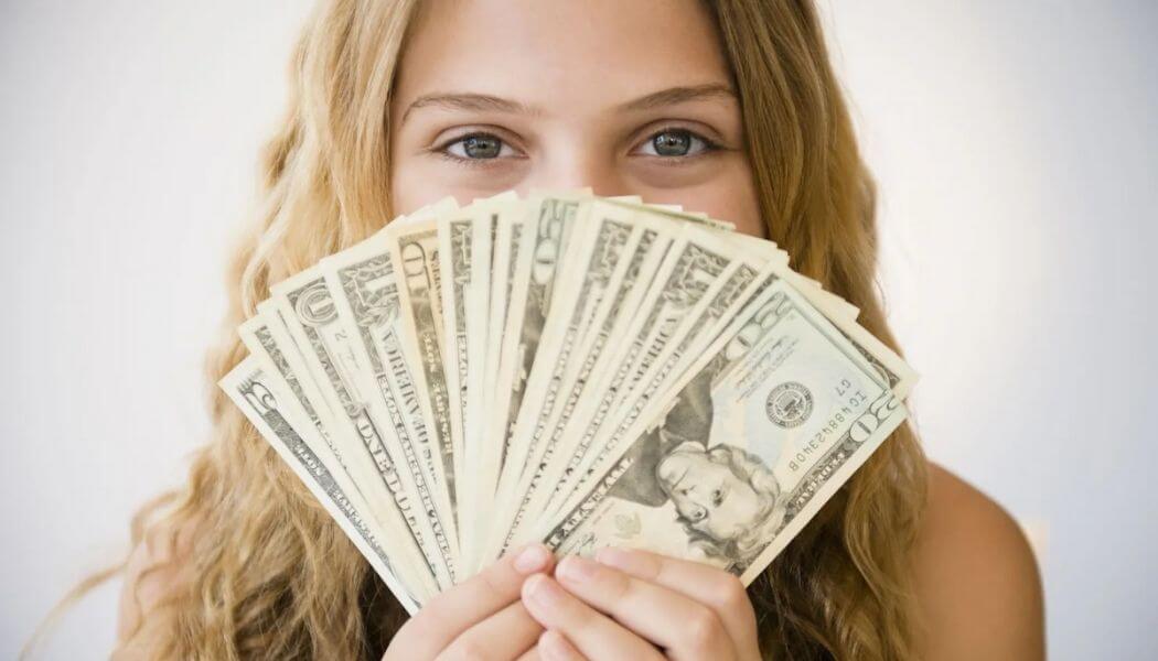 Girl holding Money