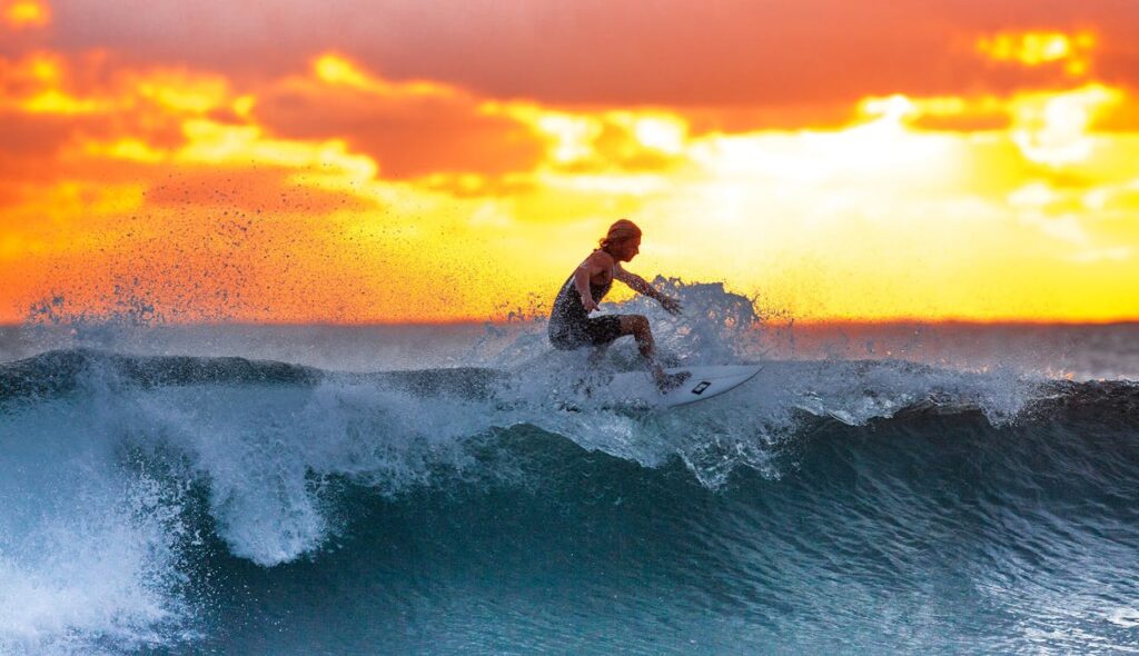 A Man Surfing in the Waves