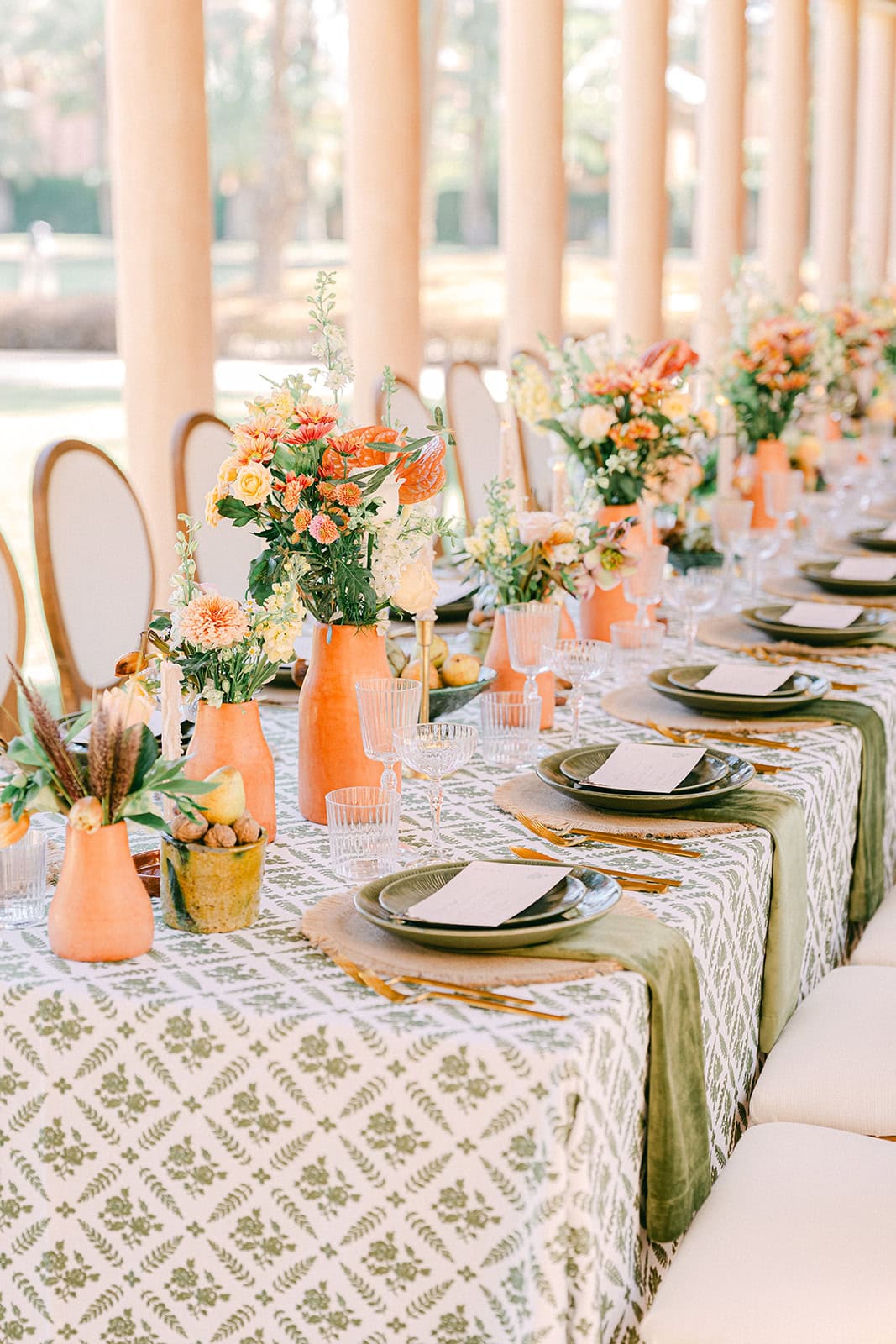 Andrea Gallucci - Destination Wedding Photographer- Amalfi Coast Positano Santorini Barcellona Rome Ravello Paris New York Morocco wedding table details with natural tones and a romantic courtyard backdrop