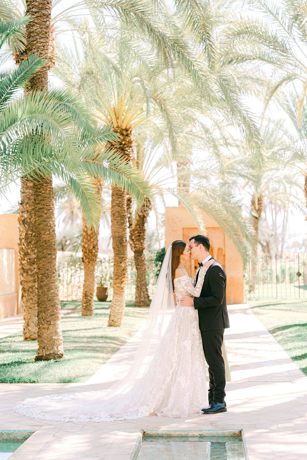 Andrea Gallucci - Destination Wedding Photographer- Amalfi Coast Positano Santorini Barcellona Rome Ravello Paris New York Romantic photos of the couple at Amanjena, with Moroccan architecture in the background and palm trees