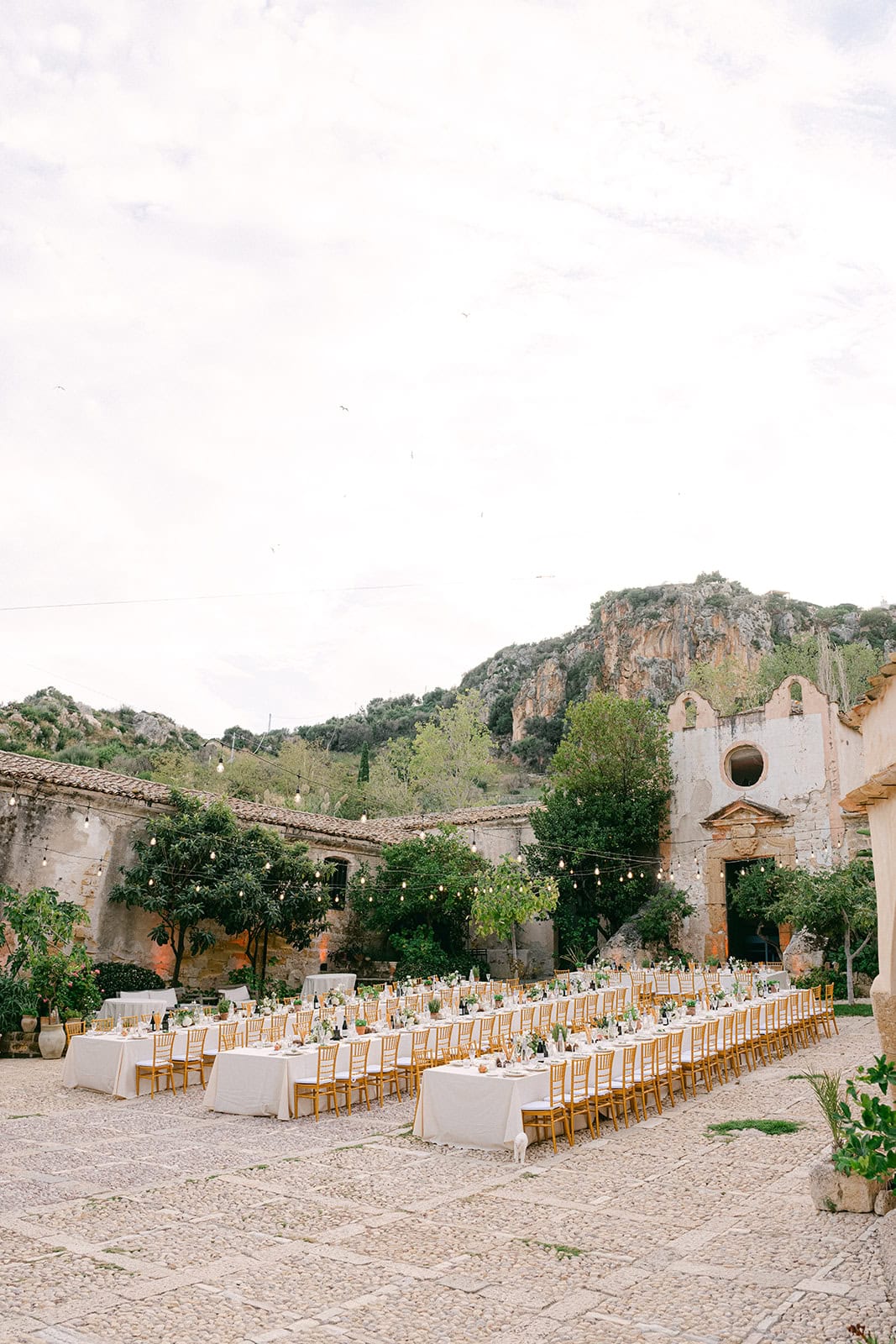 rustic wedding reception setup in Tonnara di Scopello