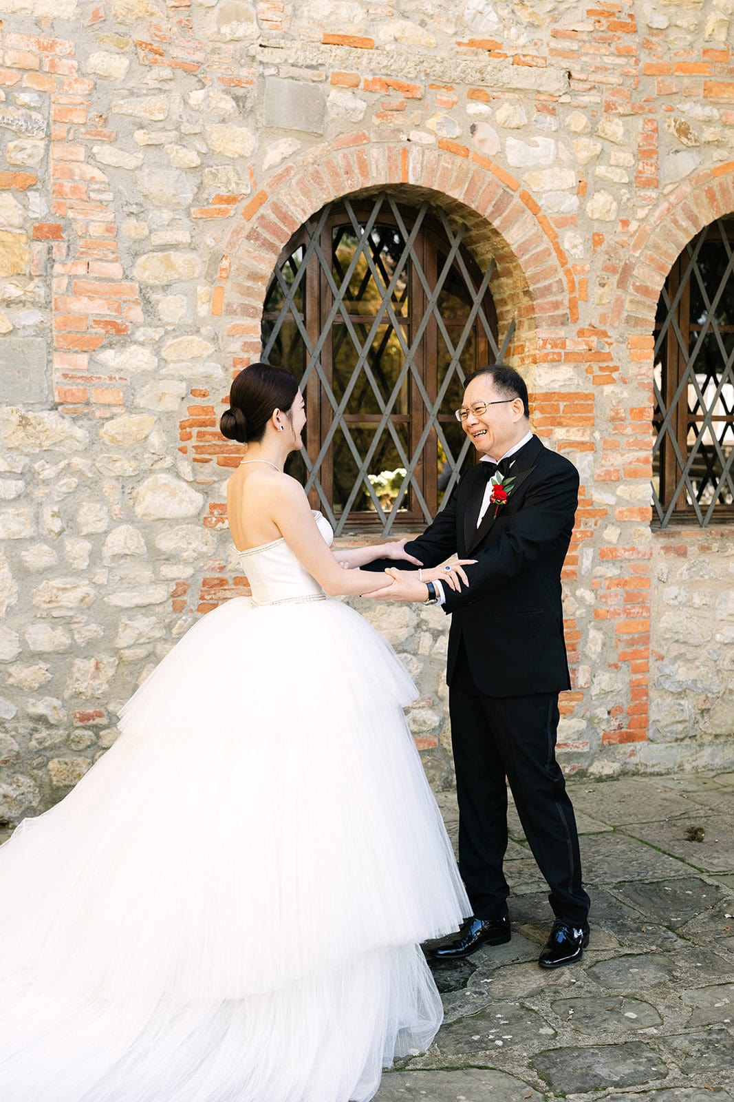 Bridesmaids reacting to bride in dress during getting ready pictures wedding