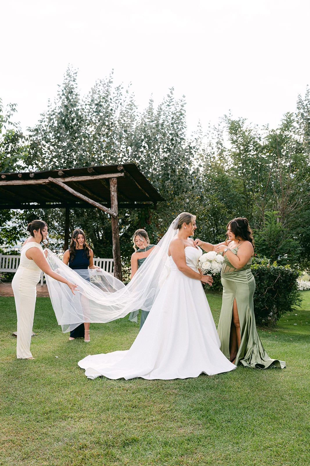 Bridesmaids laughing together during candid wedding morning preparation