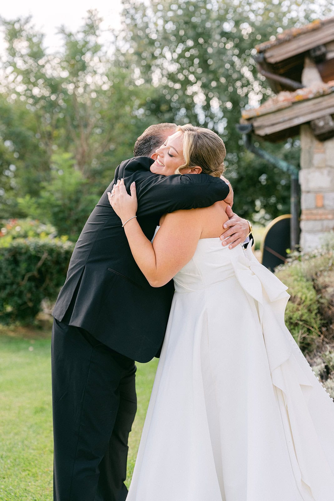 Bridesmaids hugging the bride during getting ready pictures wedding