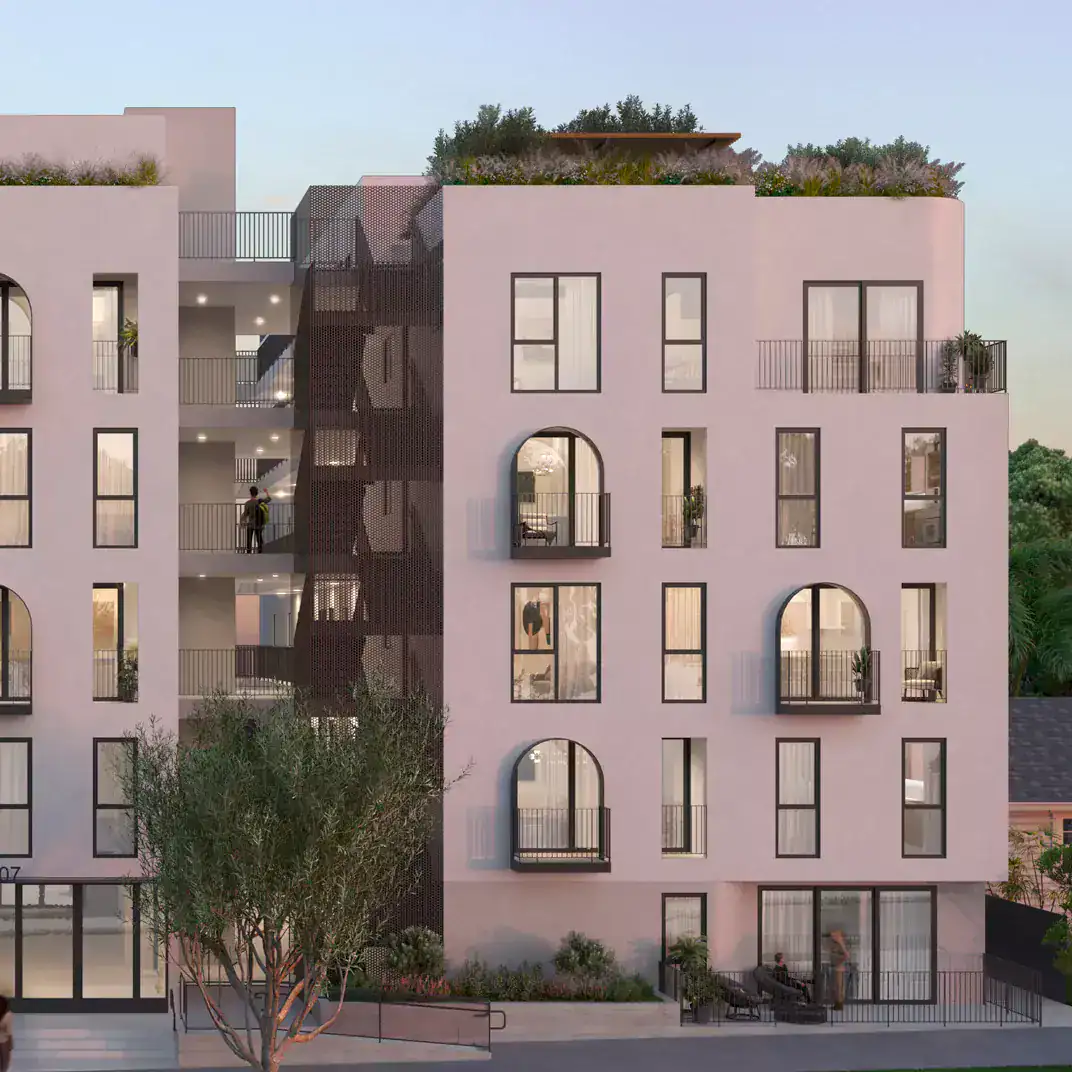 Contemporary residential apartment building with modern architectural features and rooftop gardens.