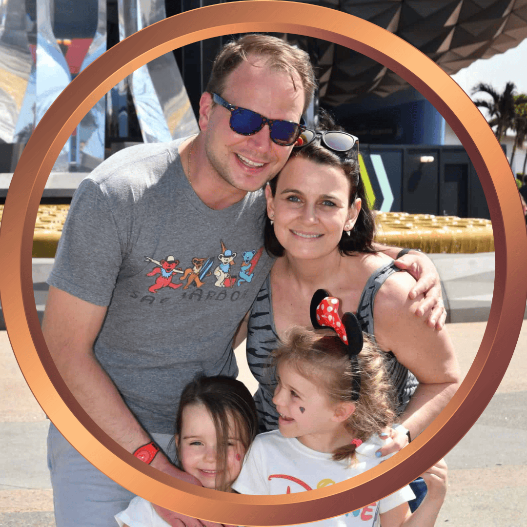 Happy family enjoying a day at a theme park with rides and attractions.