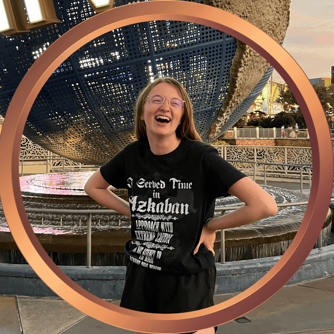 Las Vegas fountain show at sunset with smiling woman enjoying the view.