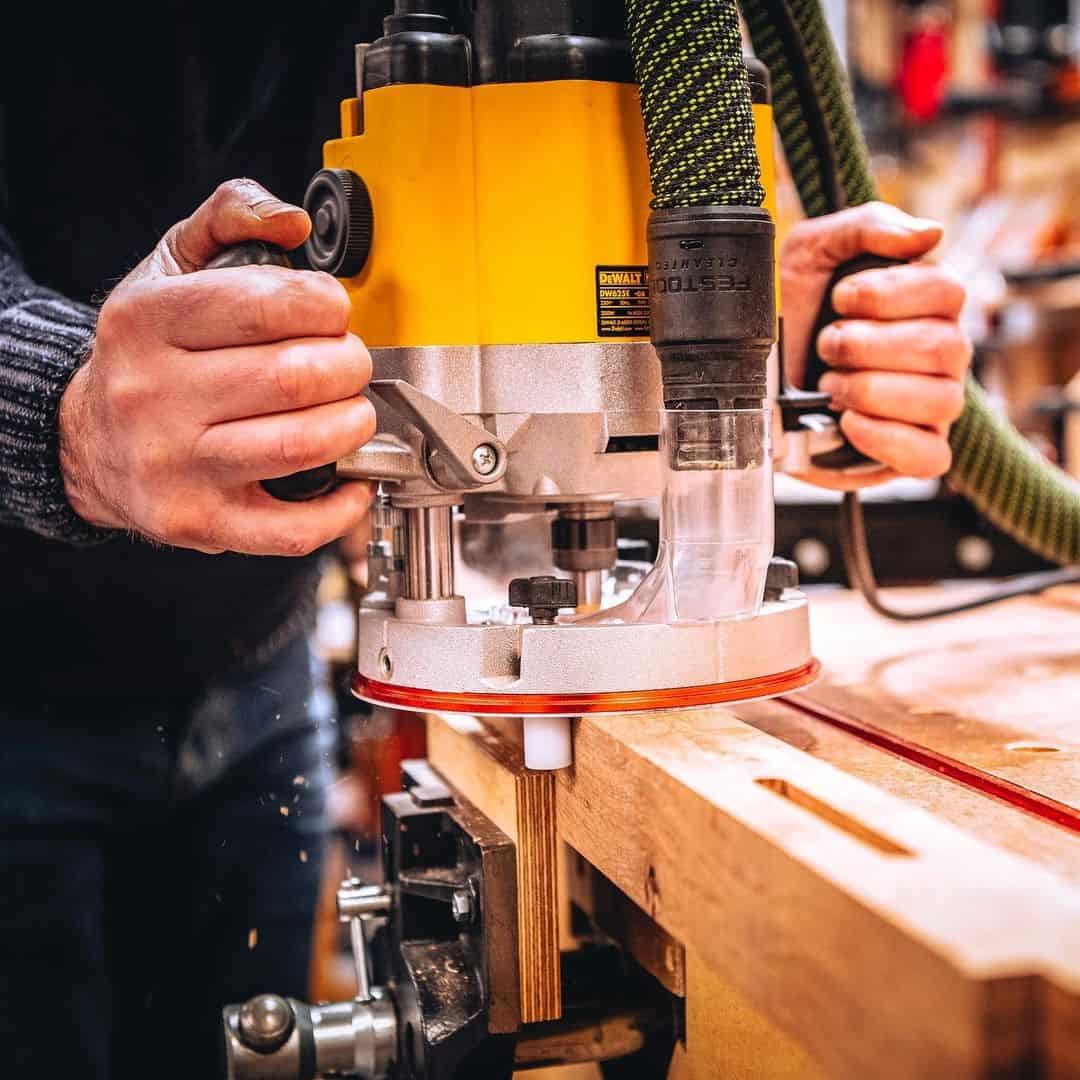 Large yellow wood router at work