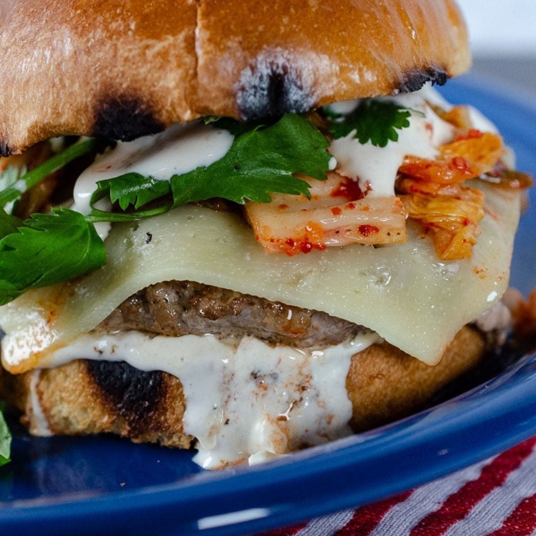 Delicious burger made with kim chi and Scorpion Hot Sauce