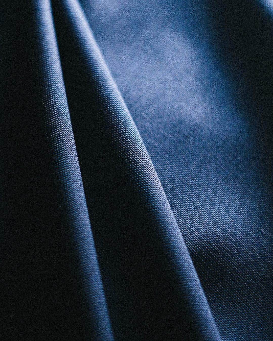 Navy wool suiting cloth falling in soft folds
