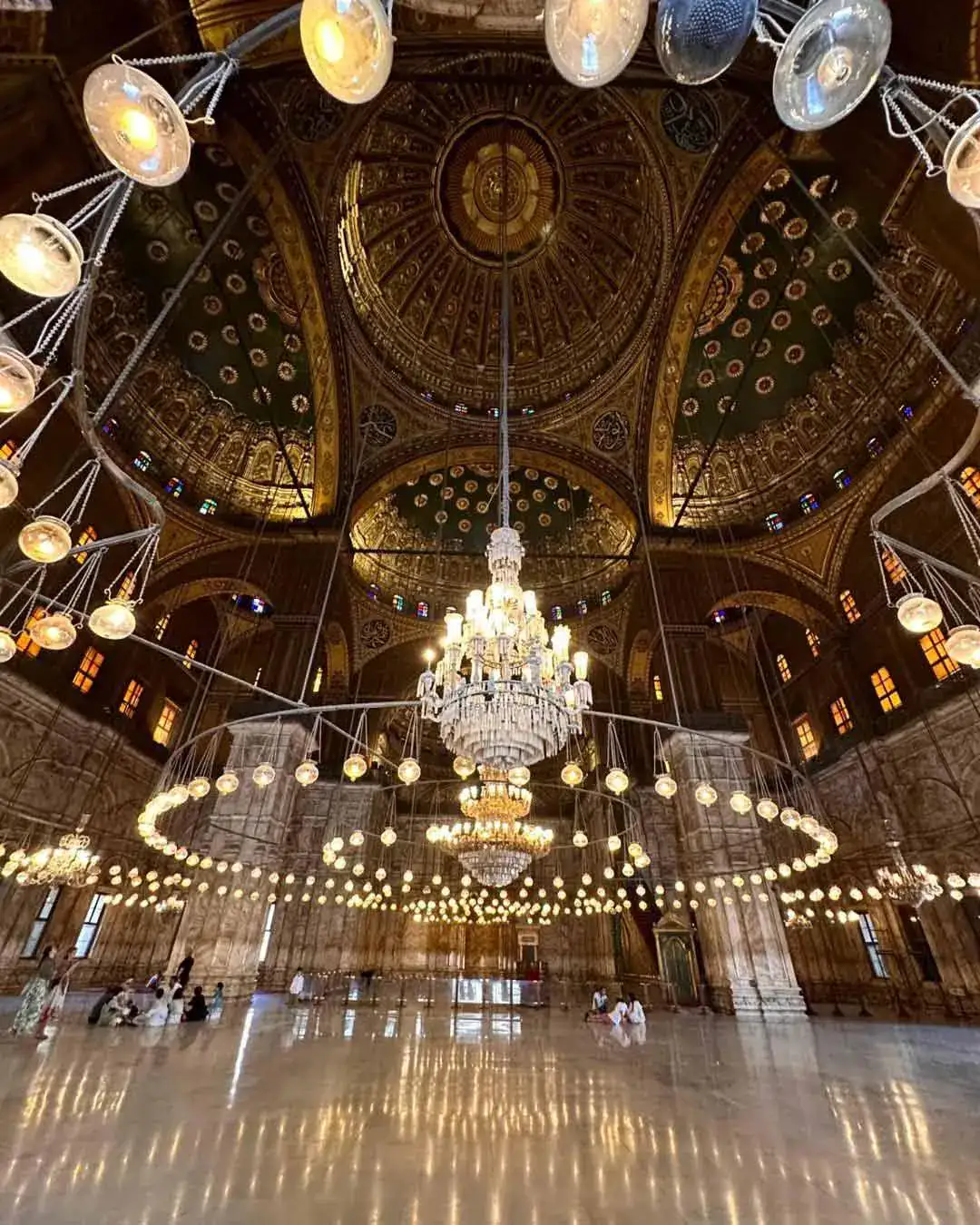 Decorated central dome and chandeliers inside Mohamed Ali Mosque