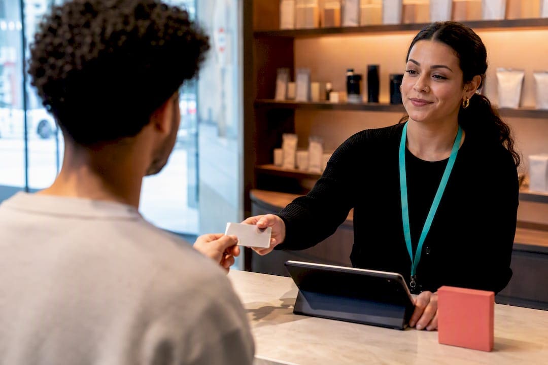 Customer presenting photo ID at cannabis store