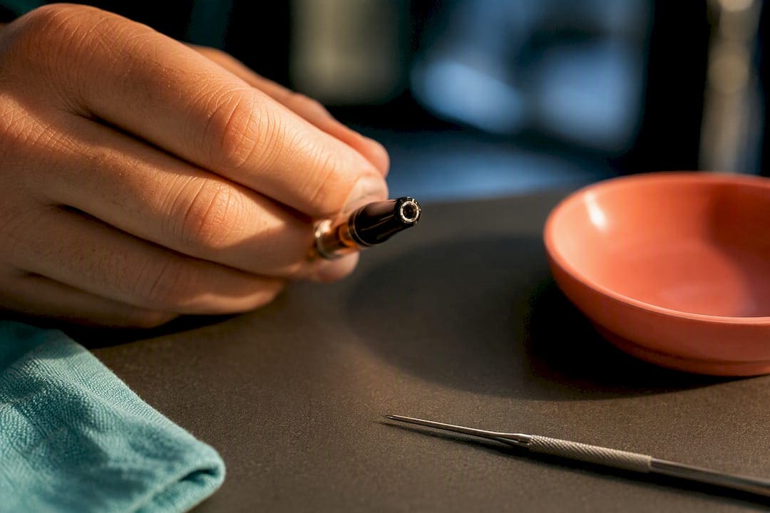 Close-up inspection of clogged cartridge mouthpiece