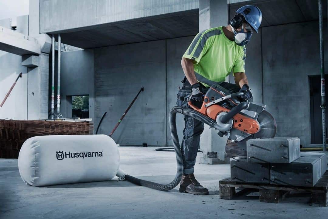 Worker saws concrete