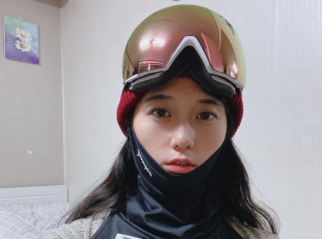 girl in ski goggles and balaclava