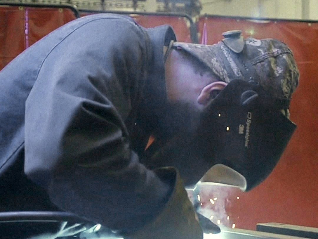 A welder at work in an Anord Mardix factory
