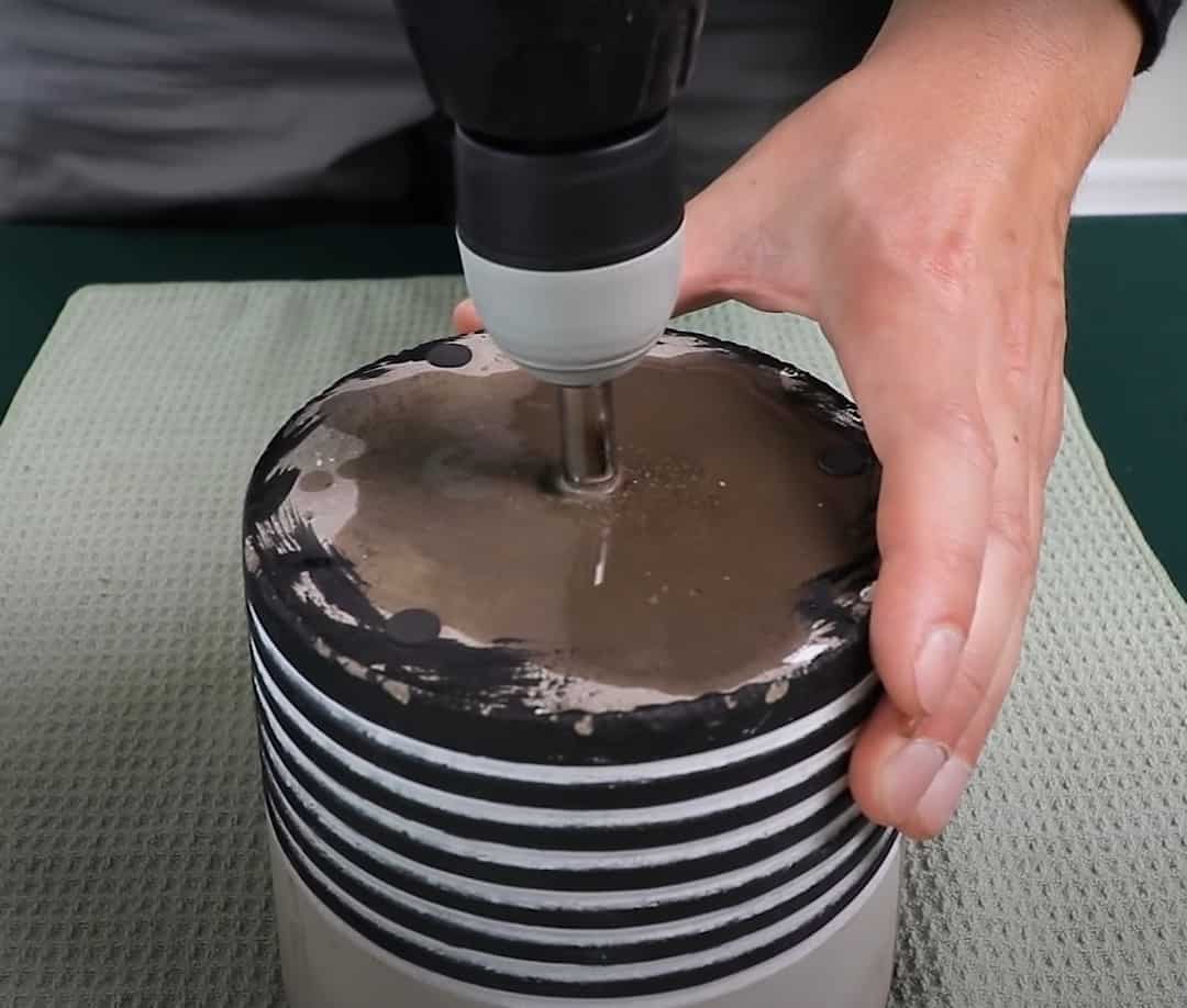 Finishing drilling a hole in a ceramic pot