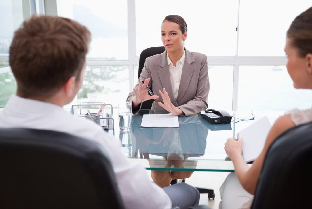 Business owners consulting with an employment attorney.