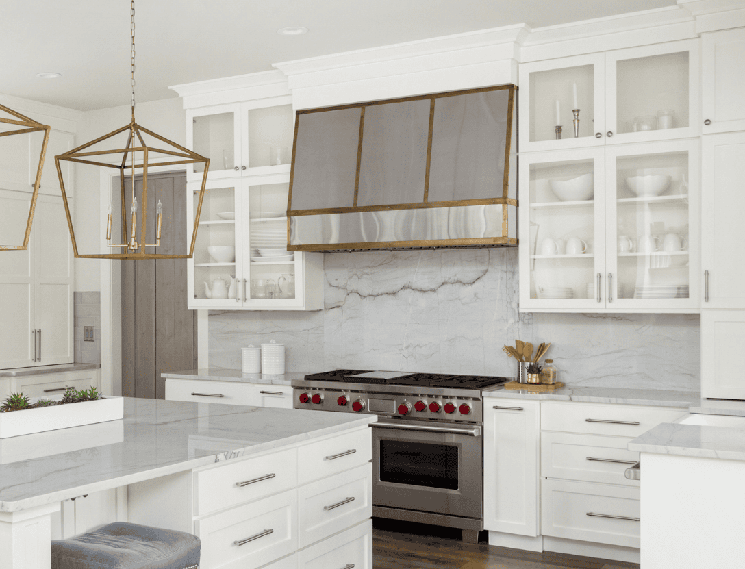 Kitchen upgraded with brass oven hood