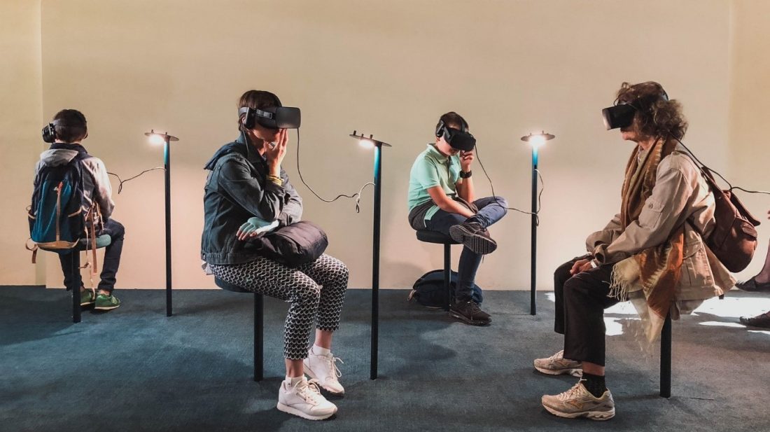 4 people wearing virtual gear