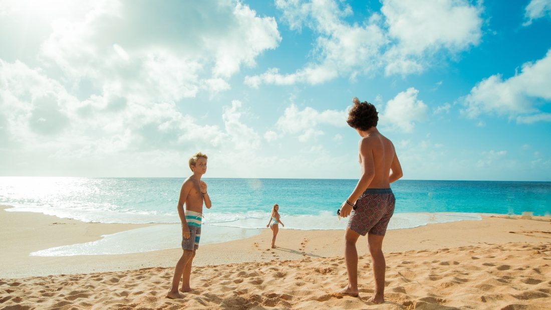 Kids playing on the beach.