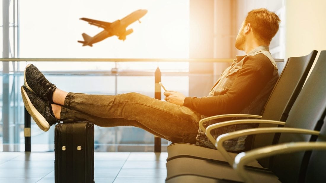 A passenger waiting for a flight at an airport.
