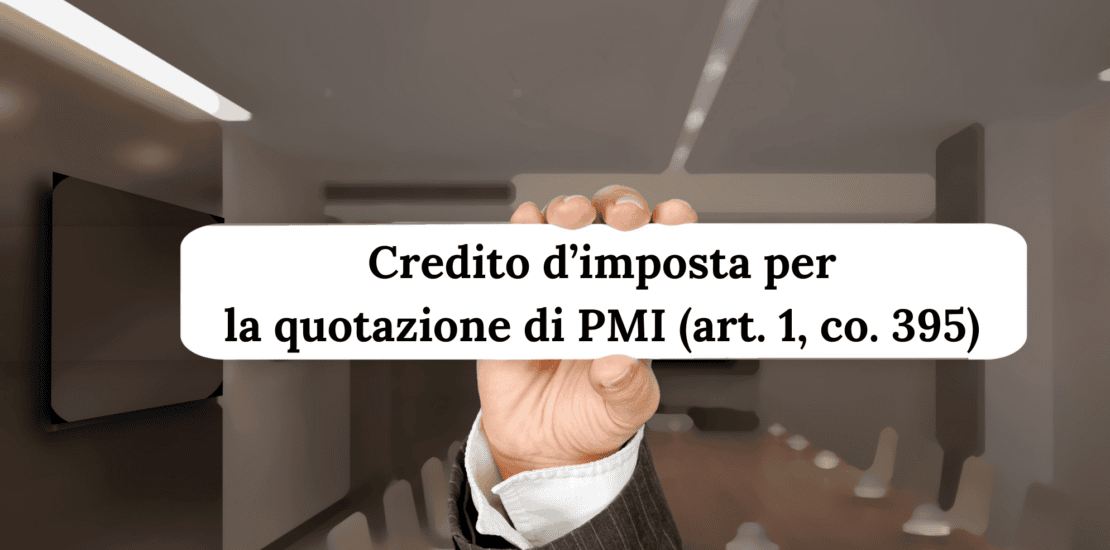 Businessman dressed up showing only his hand holiding a sign with a quote: "Credito d’imposta per la quotazione di PMI (art. 1, co. 395)"