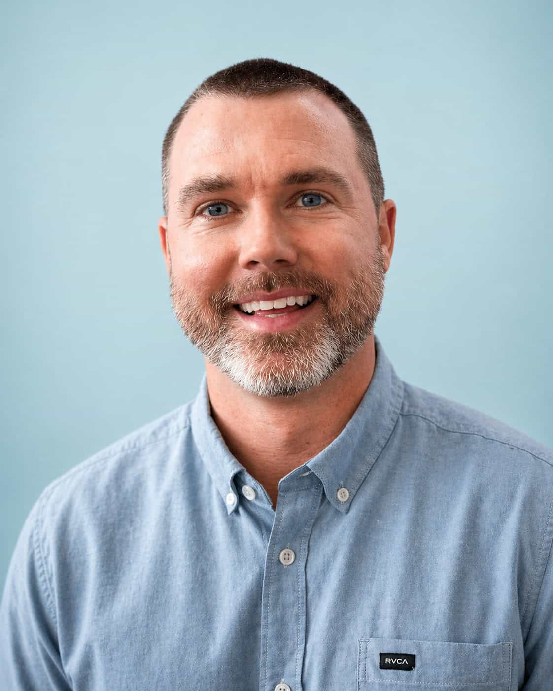 Team member portrait for 407 and Beyond Vacation Co., showcasing friendly staff.