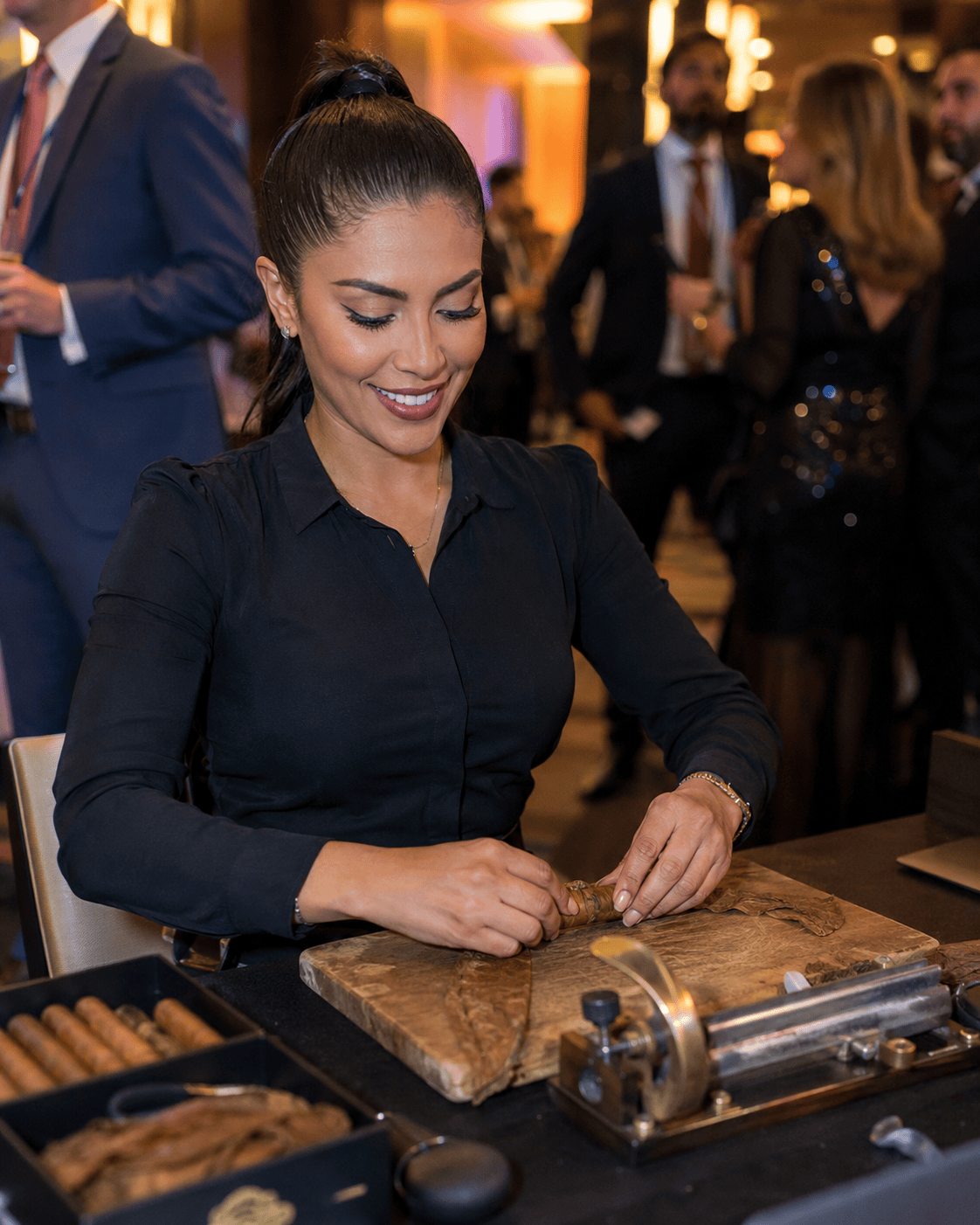 Female cigar roller demonstrating live cigar rolling entertainment for event guests