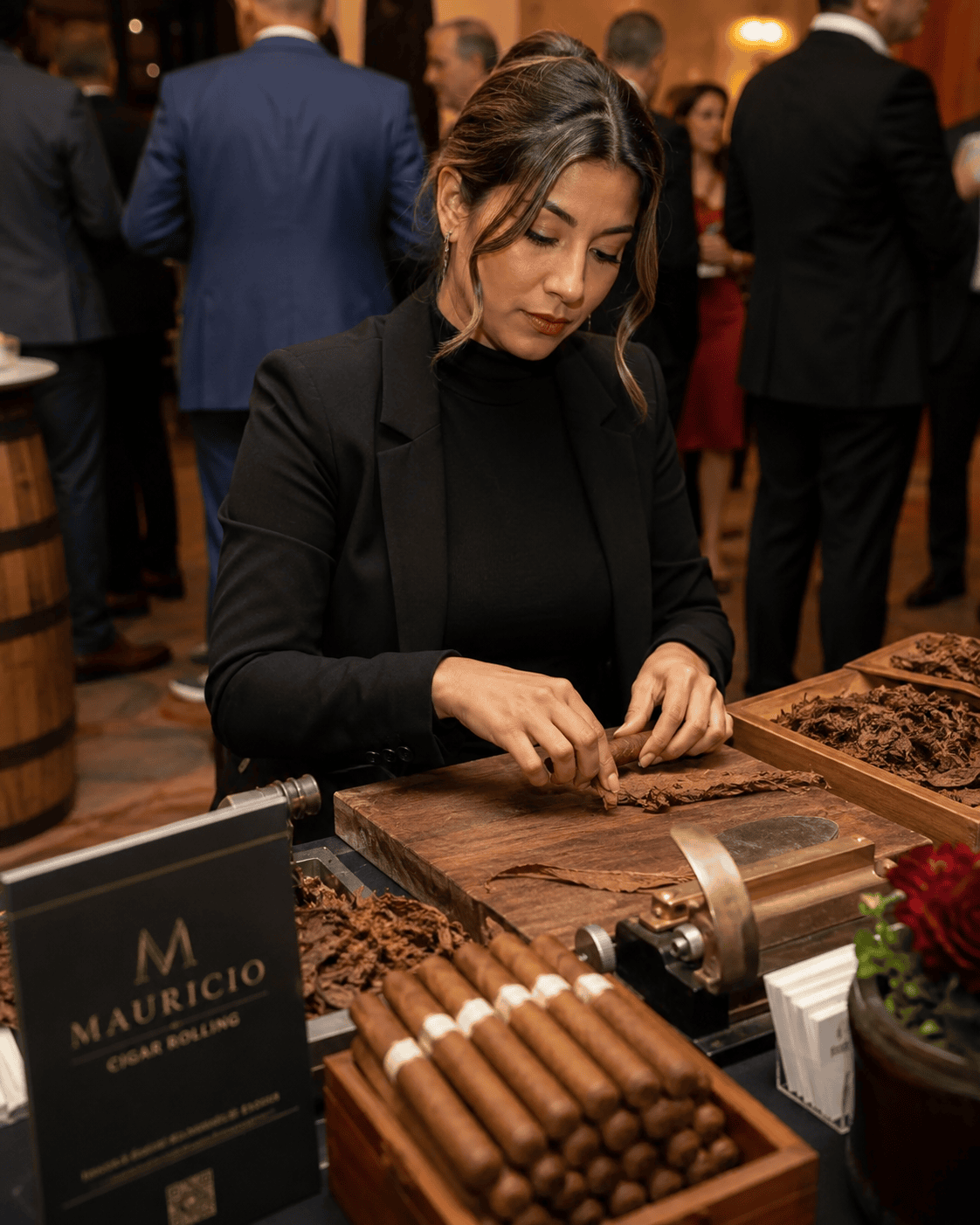 Professional female cigar roller hand rolling cigars during an elegant corporate event