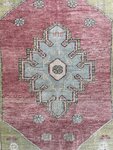 Hand-knotted Turkish wool rug with faded details