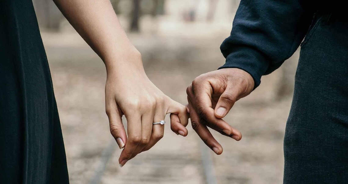 Couple holding hands