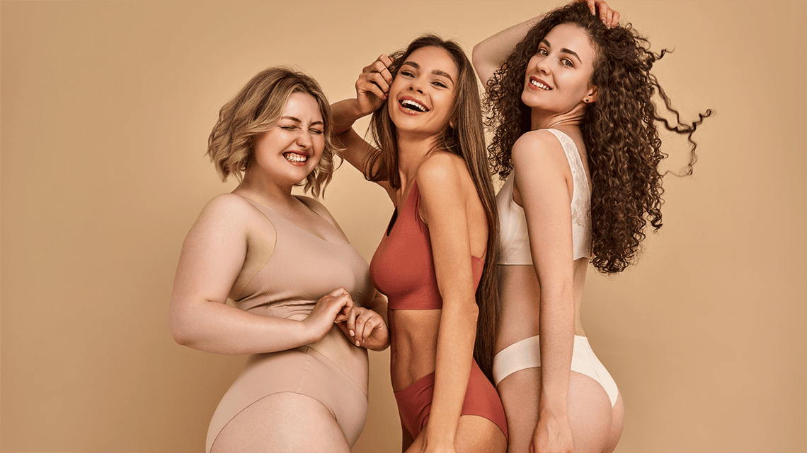 Three happy women of different body types
