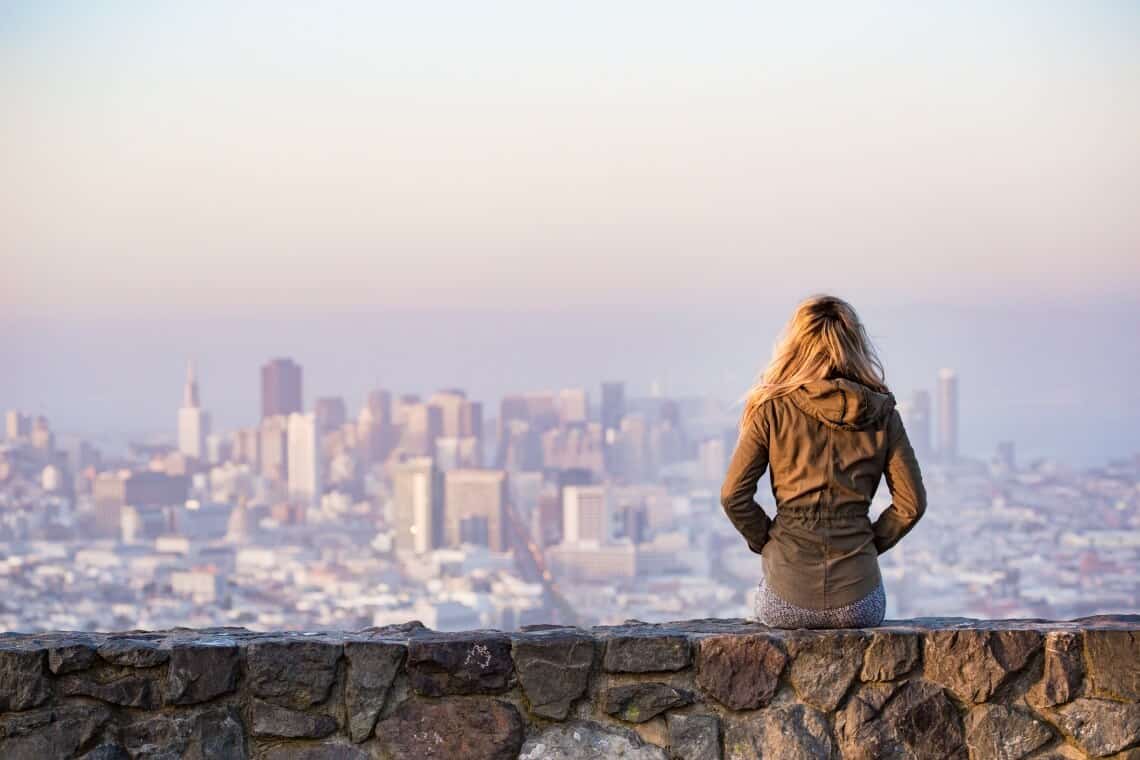 woman watching the city at dusk