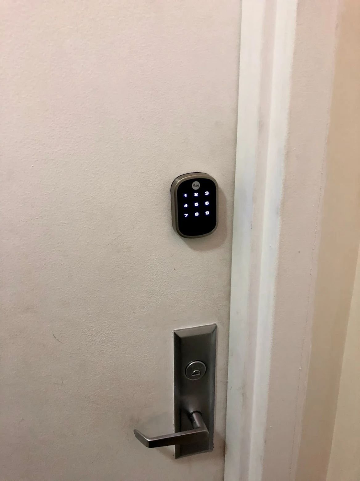 Touchscreen keyless deadbolt paired with a commercial lever handle