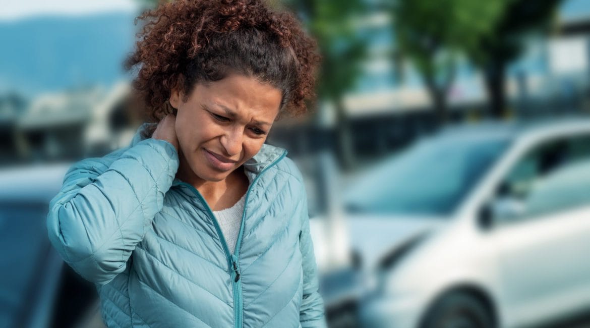 Woman suffering neck pain after car accident