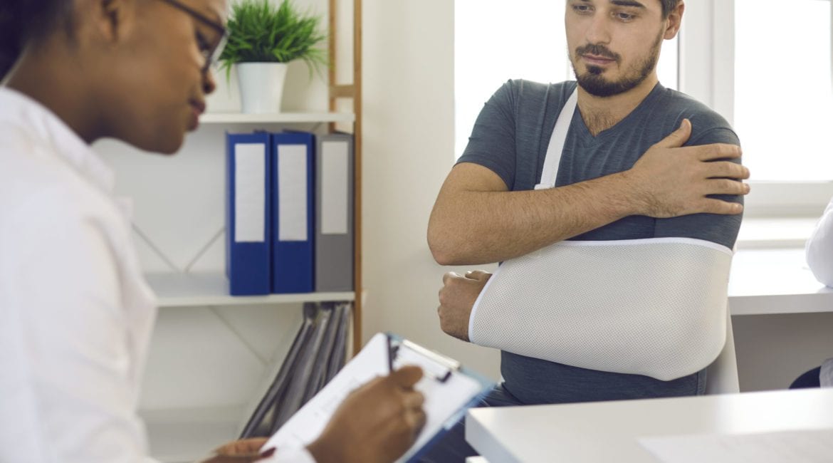 Houston injury lawyer reviewing documents with accident victim