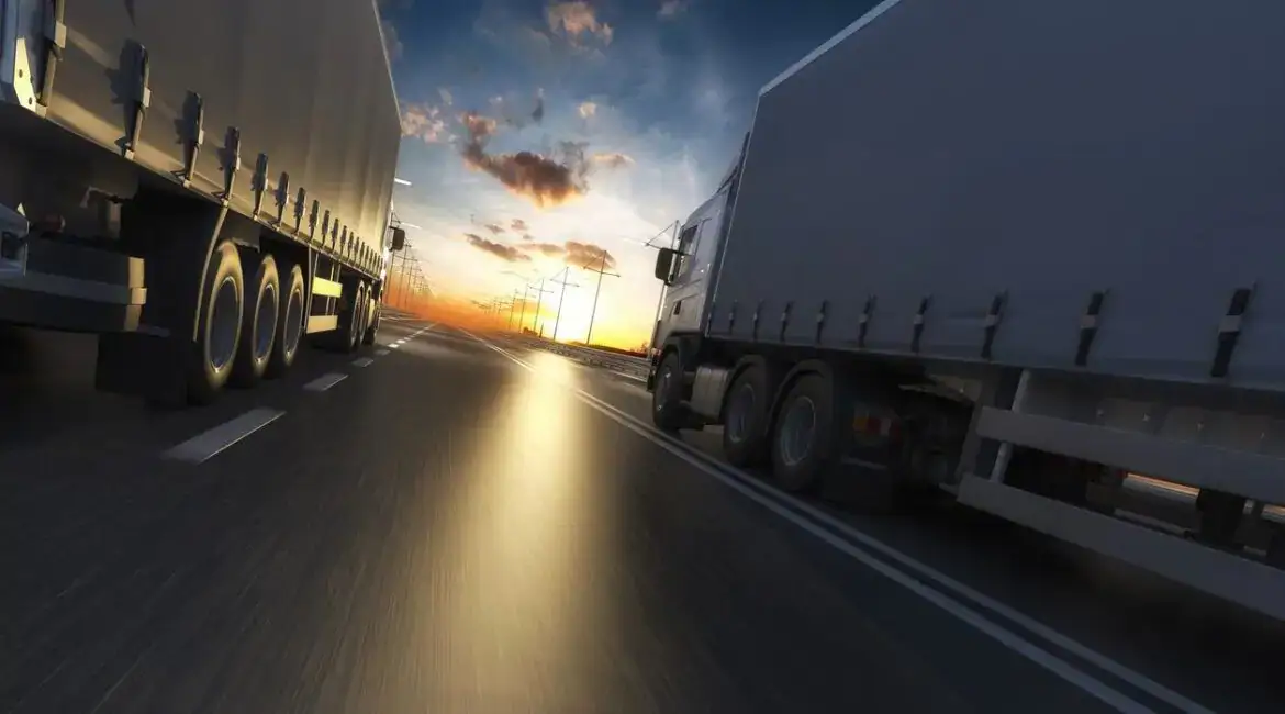 Two 18-wheelers driving down a Houston highway, representing commercial truck traffic involved in serious 18-wheeler accidents in Texas.