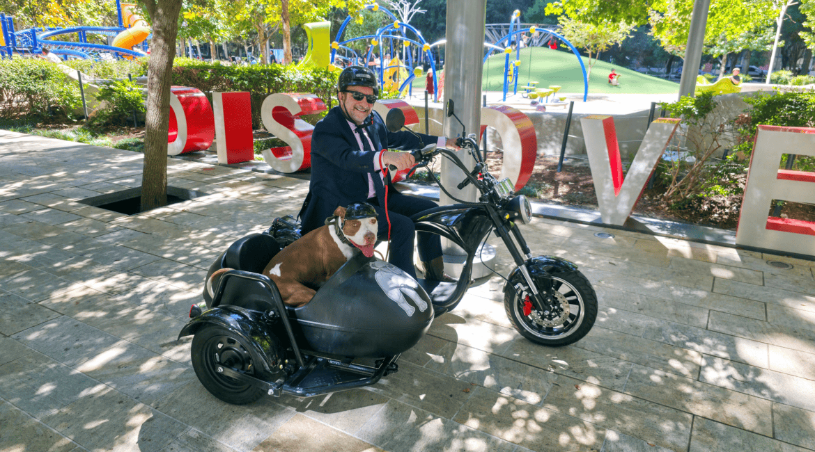 Attorney Adam Miller and his Sidekick McLovin’ on a motorcycle driving around Houston.