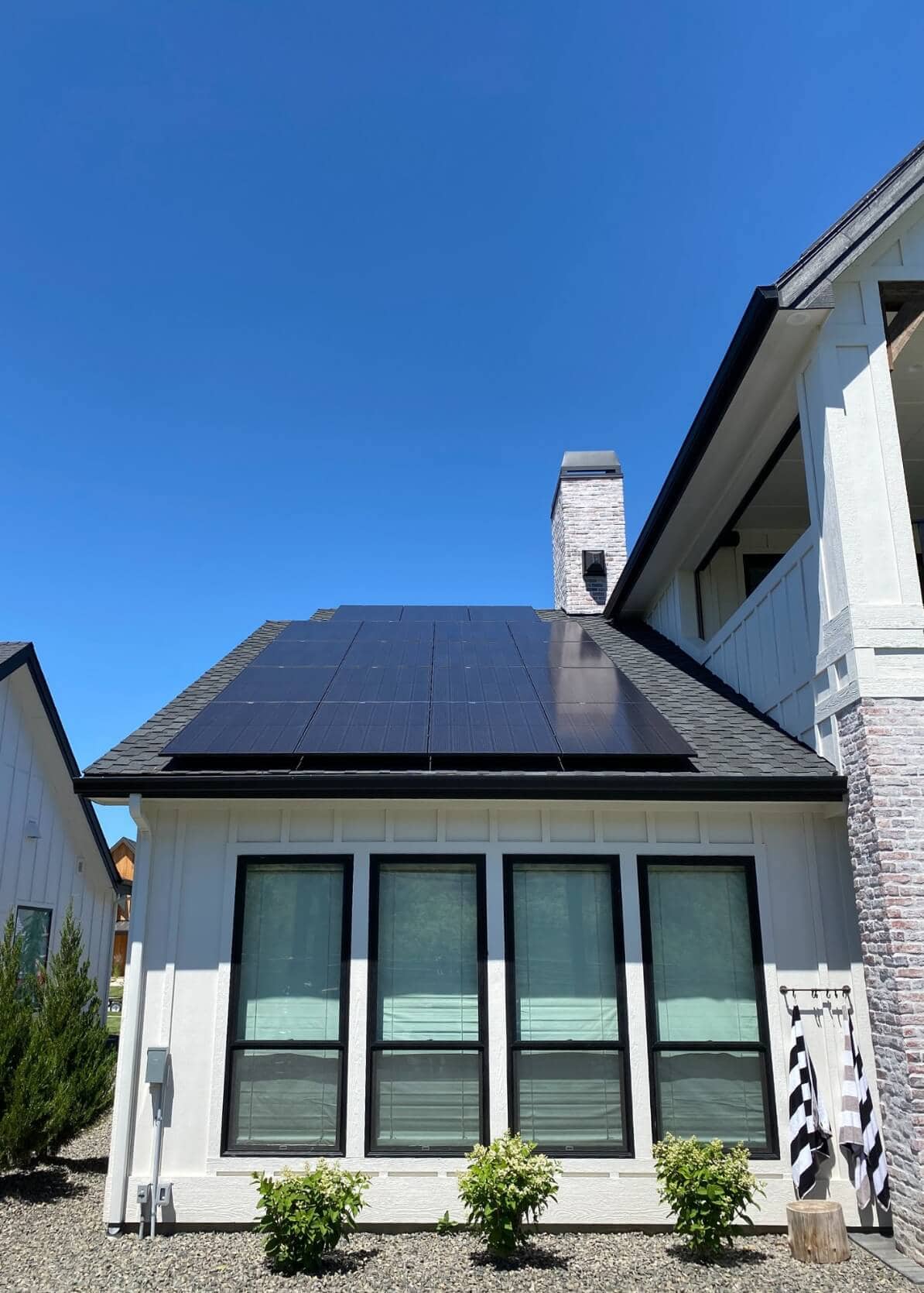 White house with solar panels.