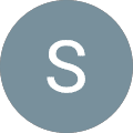 A gray circle with a white capital letter "S" centered in the middle, set against a light gray background.