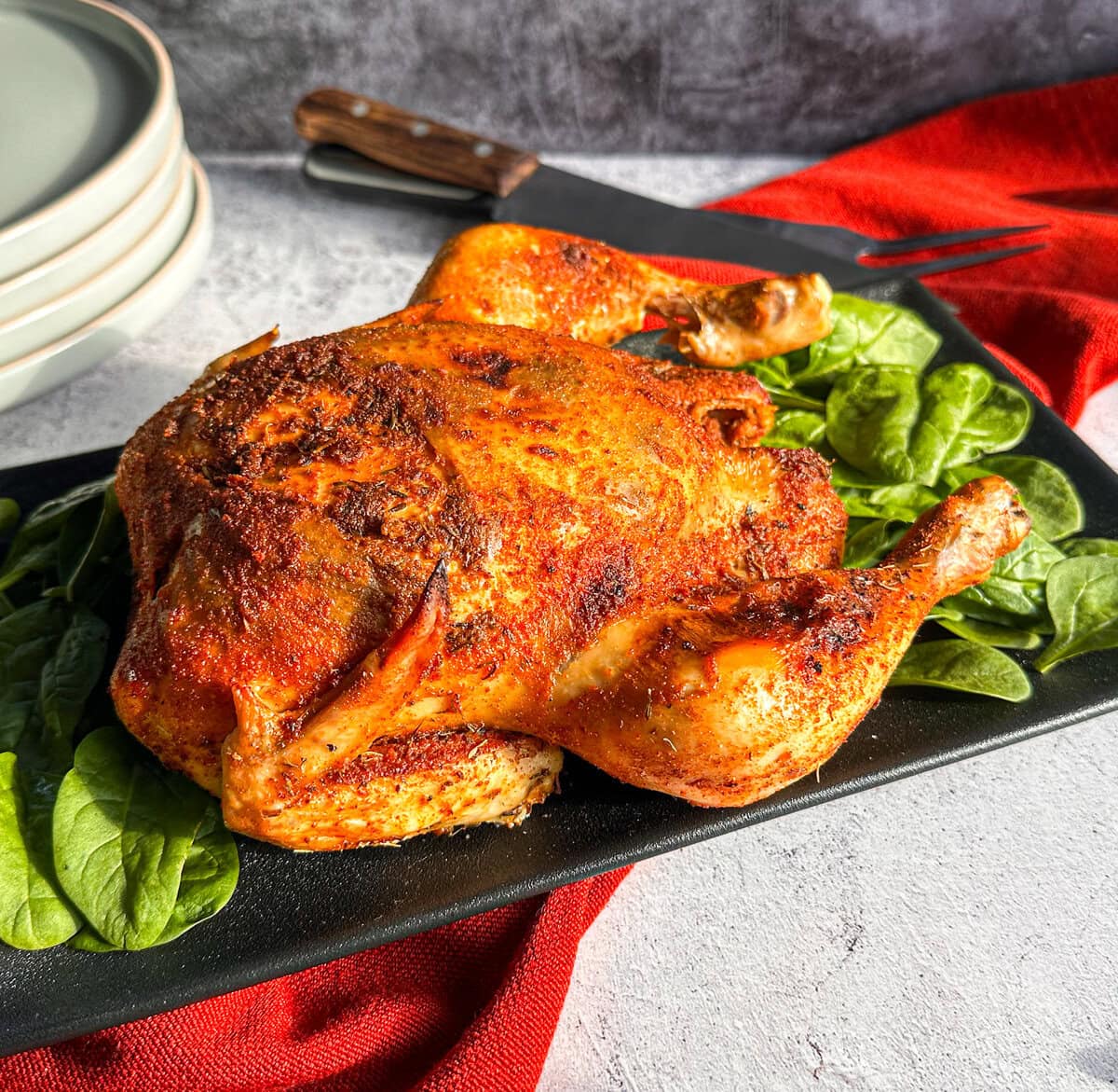 Whole golden brown chicken with methods on how to cook a chicken in a slow cooker