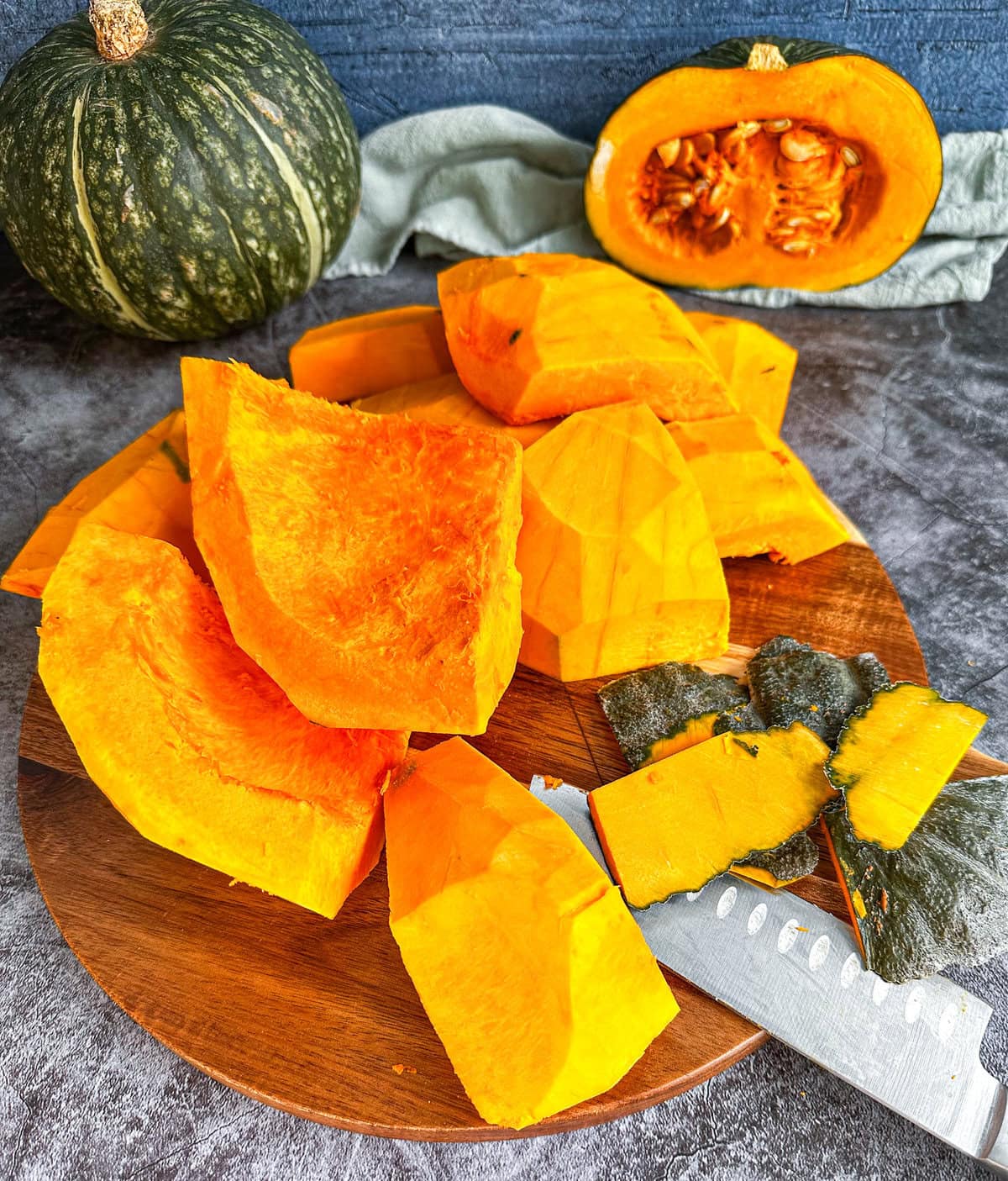 Cut fresh butternut squash with a large sharp knife.