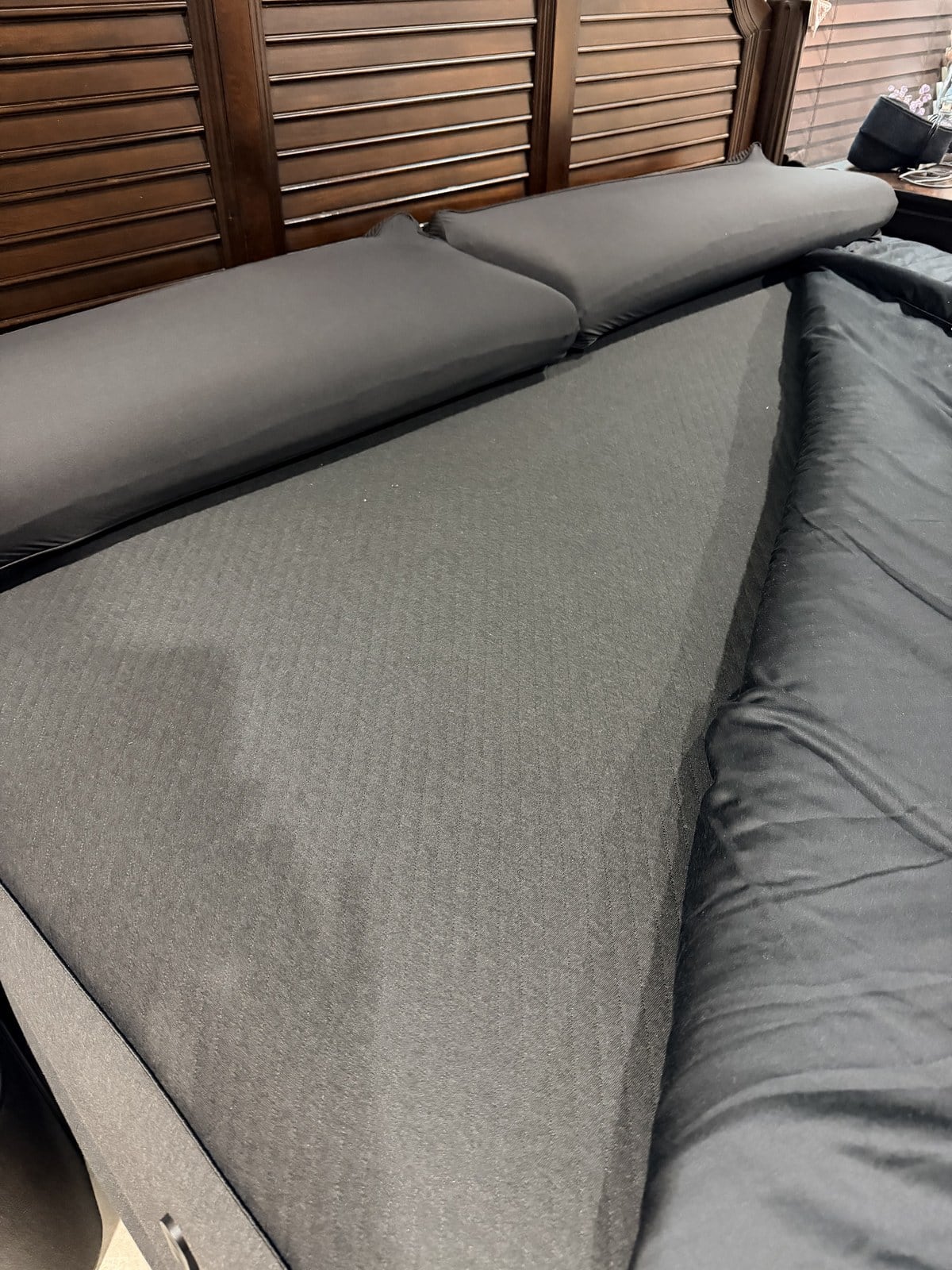 The Eight Sleep Pod 5 cover stretched over the mattress with the quilted blanket pulled back