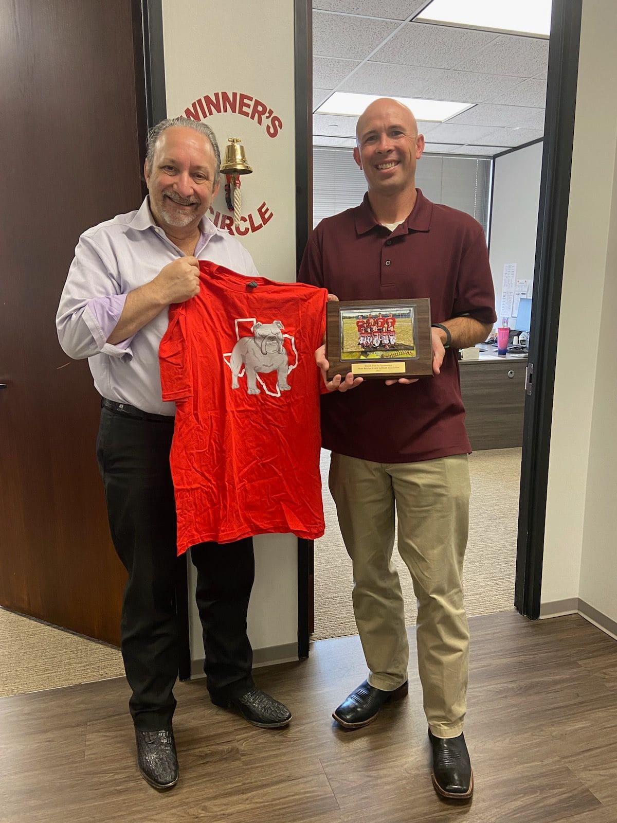 Adam Miller receiving appreciation plaque for Houston youth softball sponsorship