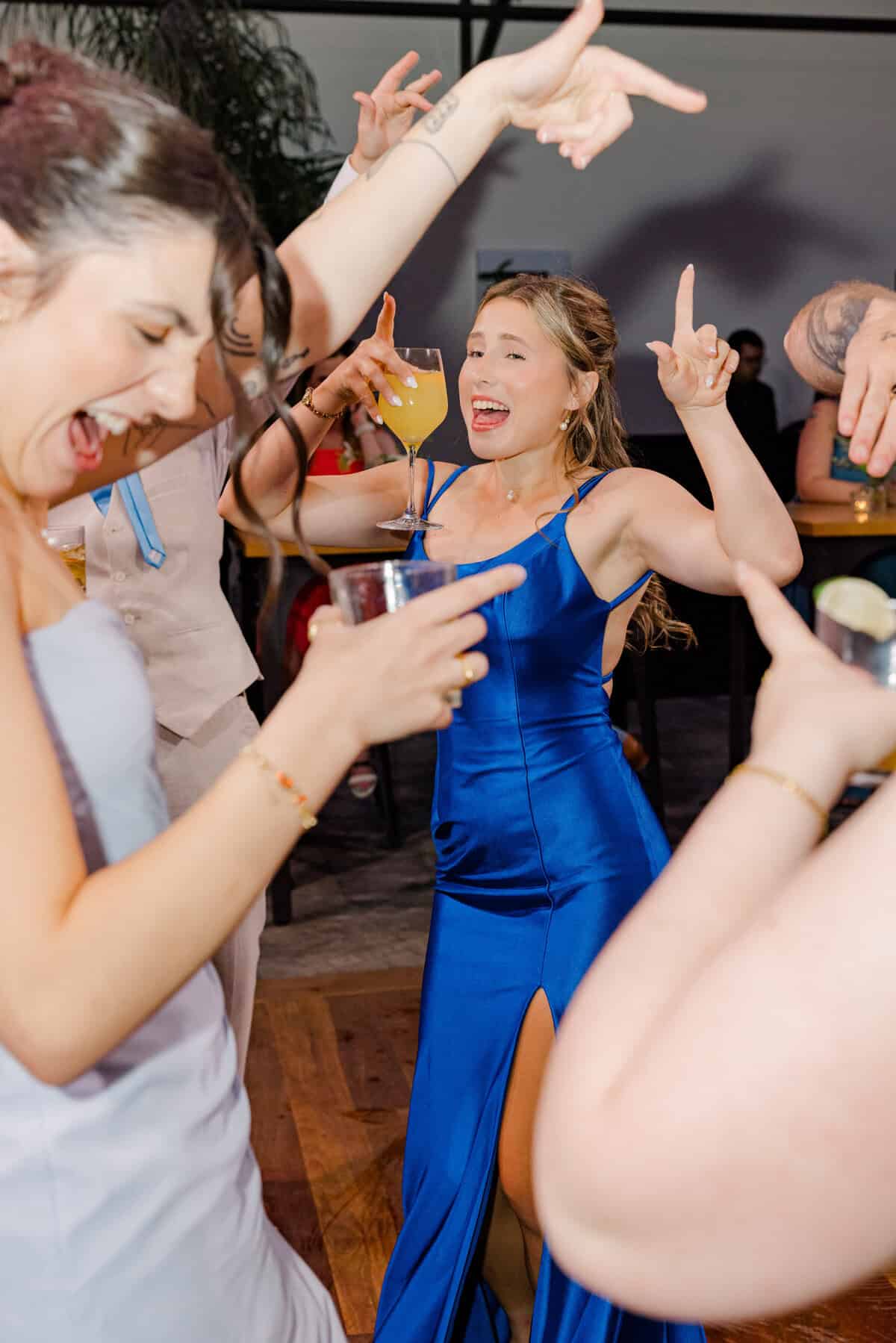 Guests dancing to EDM at Sophie and Josh's Aquatopia reception